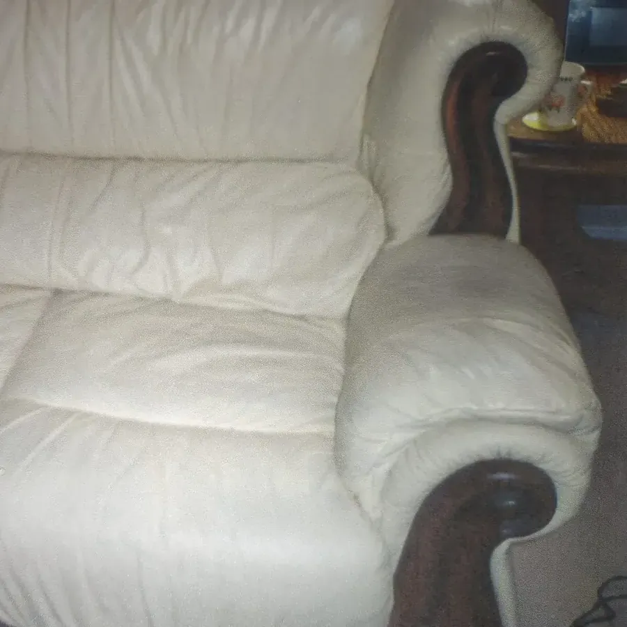 Cream leather suite arm after repair, clean and smooth